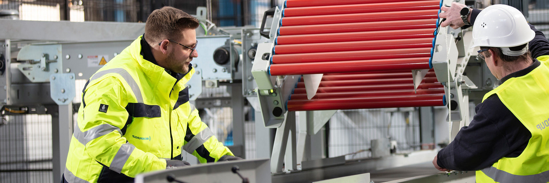 Moritz Barton on the left, Manager Training Center, from Germany, operating machine with his colleague