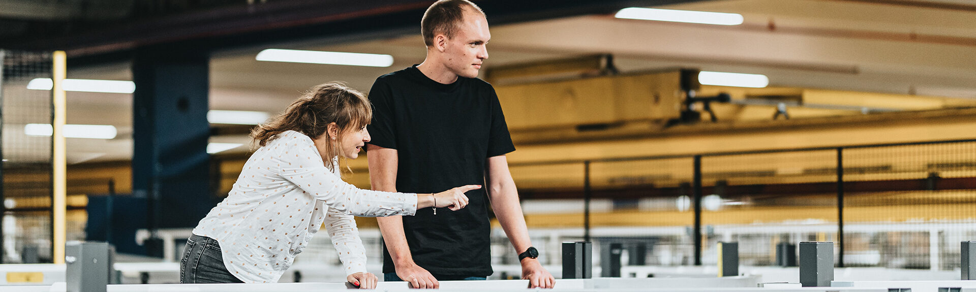 Louise Christensen, Engineering Director from Denmark shows her colleague how the system works.